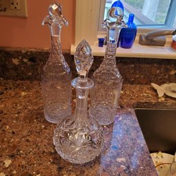 Three Highly Decorated Crystal Decanters / Tall Cruets