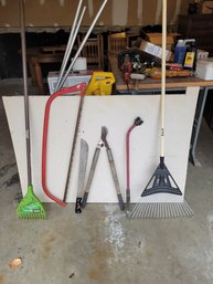 Great Assortment Of Yard ToolsRakes ,  Branch Saw Garden Nozzle, Pruning Clippers, Machete,