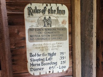 A 'Rules Of The Inn' Wooden Sign
