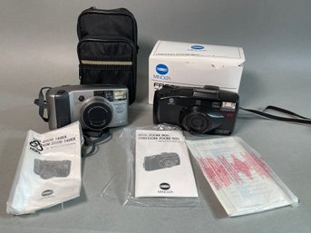 Two Minolta Cameras And A Case