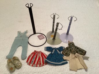 Lot Of Vintage Doll Clothes And Four Doll Stands