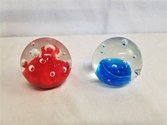 Two Handblown Bubble Glass Red And Blue Paperweights