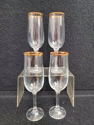 Four Clear Crystal Gold Rimmed Champagne Glasses