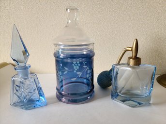 Two Blue Vintage Perfume Bottles And Another Vintage Glass Container With Lid