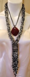 Two Tribal Necklaces One Black And White And Red Pendant