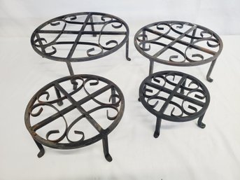 Set Of Four Black Wrought Iron Scrolled Plant Stands In Various Sizes