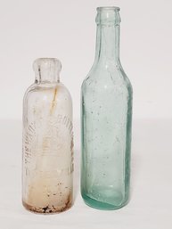 Two Antique Bottles - Clear The Harkness Bottling Co & Unbranded Aqua Bottle