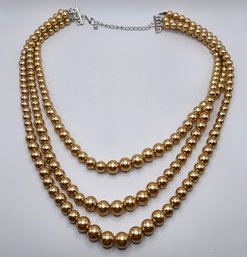 Simulated Golden Pearl Triple Row Necklace In Silvertone