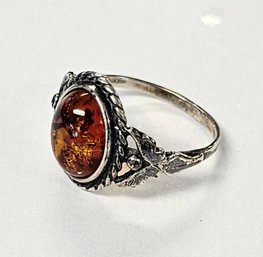 Vintage Sterling Silver AMBER Ring With Rope Frame...Looks Like ANGELS Holding The Stone Upon Each Side?