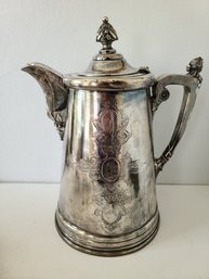 Extremely Heavy Vintage Silver Plate Tea/Coffee Pot With Figurine On The Spout
