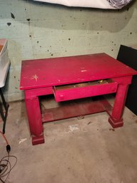 Workhorse Of A Work Table.  This Red Beauty Is Strong And The Drawer Works.