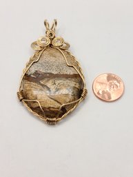 Large Natural Stone Wrapped In Gold Plated Swirls
