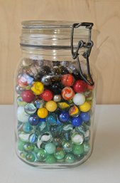Large Glass Jar Full Of Marbles