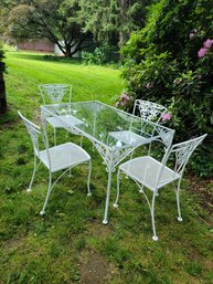 Vintage Metal Outdoor Table With Glass Top And Four Chairs With Leaf And Rose Motif