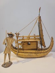 Wicker Boat And Man Figurines