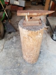 Antique Steel Railway Anvil On Wood Log Post