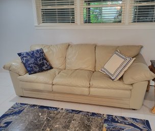 Sealy Leather Couch.  Sand Is The Color.  2 Pillows