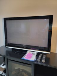 Samsung T.V. ( Television ) With Remotes And Books.