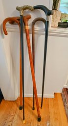 Group Of Five Walking Sticks/ Canes One Stamped Bridges With An Engraved Brass Handle