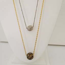 Jazzy Pave Ball Pendant With Yellow And Copper CZ's Paired With White Crystal Ball