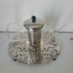 Vintage Glass Teapot Paired With Silver Plated Trivet