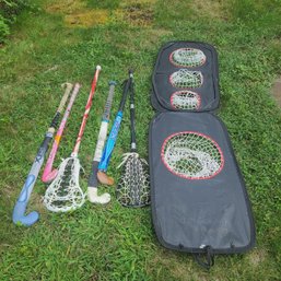 Group Of Girls Field Hockey Sticks And Lacrosse Sticks And Nets