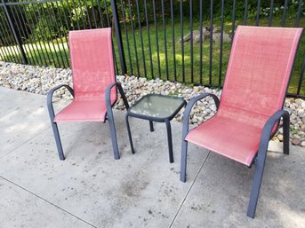 Two Red Sling Patio Chairs & Small Glass Topped Accent Table