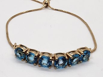 Blue Topaz Adjustable Bolo Bracelet In 14k Yellow Gold Over Sterling