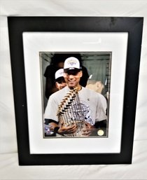 Framed Photograph Of New York Yankees Captain Derek Jeter Holding 2009 World Series Trophy