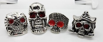 Lot Of 4 Novelty Skull Rings With Red Eyes