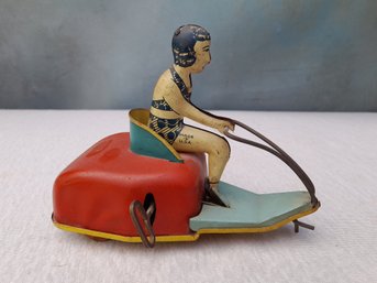 VINTAGE LINDSTROM TIN WINDUP LADY ON MOTOR SCOOTER