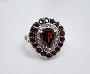 Red Garnet, White Zircon Halo Ring In Platinum Over Sterling