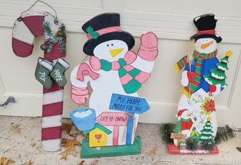 Trio Of Wooden Christmas Snowmen And Candy Cane