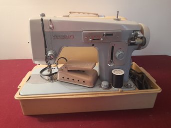 White Sewing Machine In Case