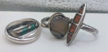 Four Sterling Silver Rings With Turquoise, Cats Eye? And Amber?
