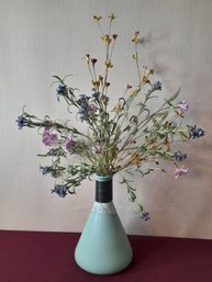 Faux Flowers In Blue Glazed Vase