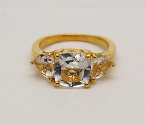 White Topaz 3 Stone Ring In Yellow Gold Over Sterling