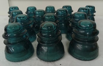 Sixteen Green Glass Insulators