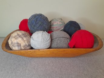 Balls Of Fabric With Carved Wooden Bowl Decor