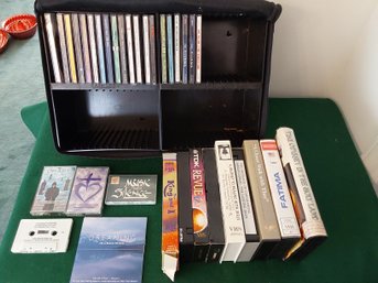 TRAVEL/STORAGE CASE OF CASSETTE TAPES, DVD'S AND VHS TAPES ALL UNTESTED