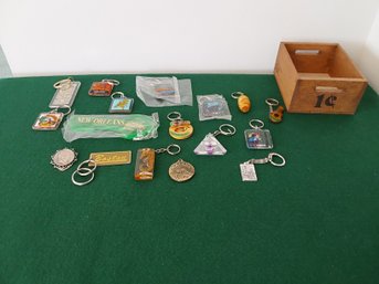 LARGE LOT OF SOUVENIR KEYCHAINS WITH 1 CENT WOODEN BOX