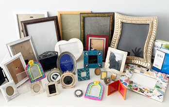 A Large Assortment Of Photo Frames