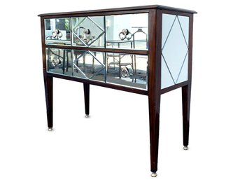 A Mirror Paneled Console By Maitland-Smith