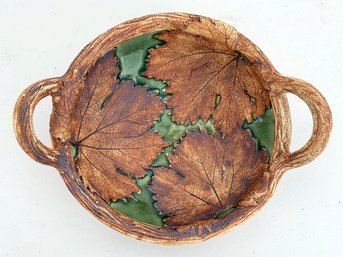 A Ceramic Bowl With Autumn Leaf Motif