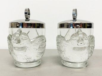 A Pair Of Lidded Glass Egg Cups