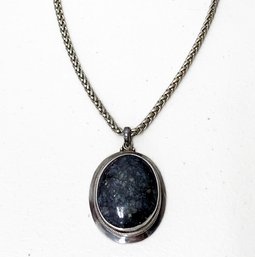 A Tourmaline Stone In Sterling Silver Necklace And Setting