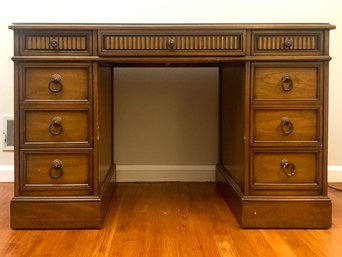 A Classic Vintage Kneehole Desk With Tooled Leather And Glass Top BY Sligh Furniture Of Michigan