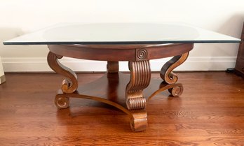 A Carved Oak And Glass Coffee Table