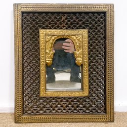 A Parcel Gilt And Carved Wood Indian Mirror