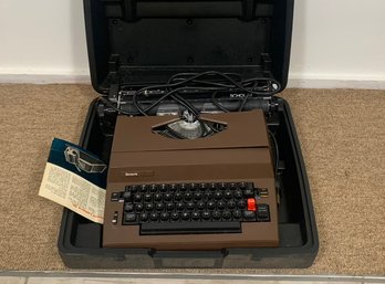 A Vintage Sears Typewriter In Original Case